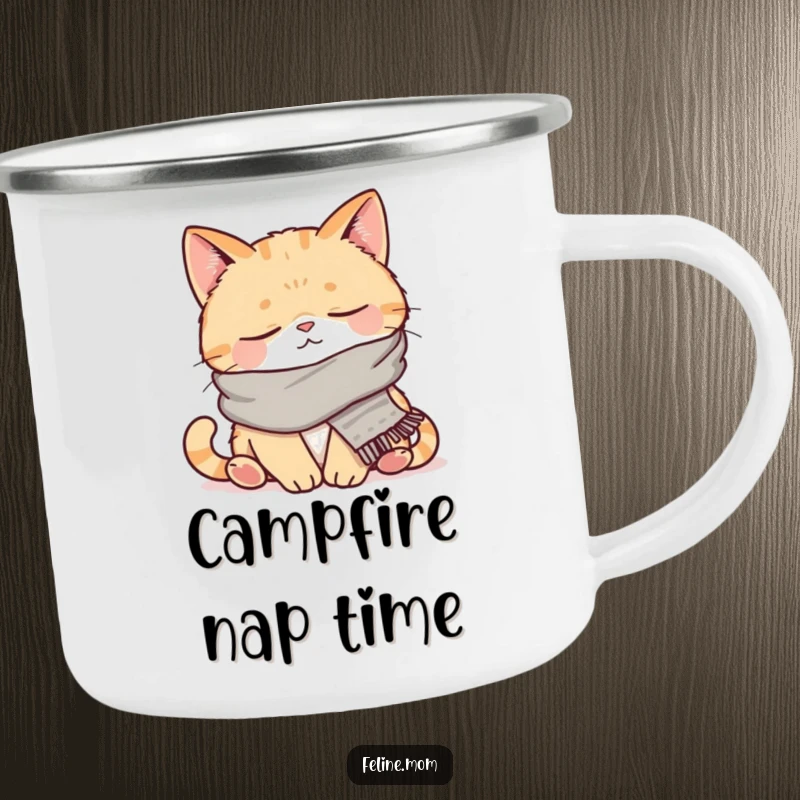 Funny enamel camping mug depicting a napping cat wearing a scarf. This durable cup brings humor and coziness to any outdoor excursion.