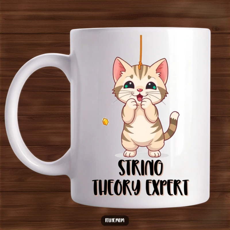 Funny Mug: A lively tabby cat playfully bats at a dangling string, full of feline mischief.