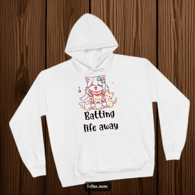 Funny Kawaii Cat Lady Hoodie featuring a cute character observing cats enthusiastically playing with a dangling toy, perfect for cozy days.