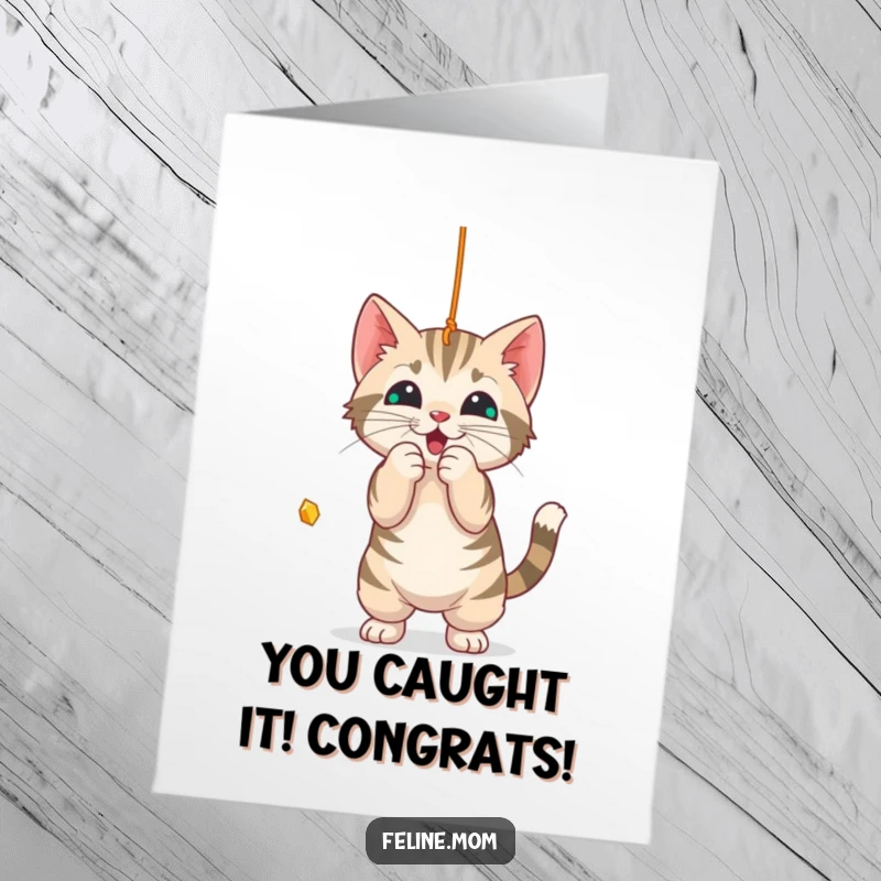 Funny Free Printable Congratulations Card: A tabby cat actively plays with a dangling string, symbolizing playful determination.