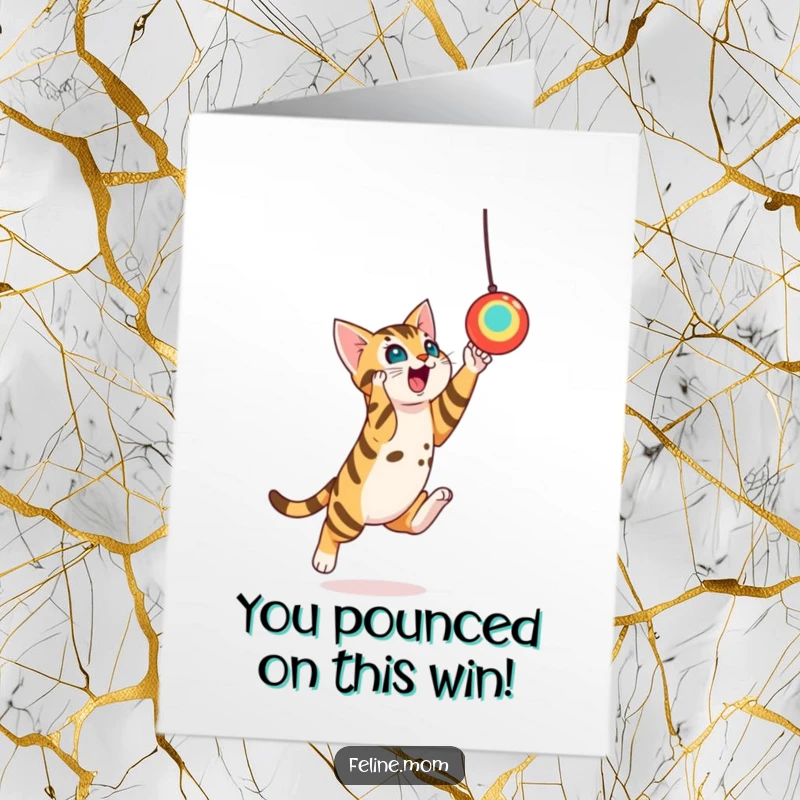 Funny Free Printable Congratulations Card showing a playful Bengal cat making an impressive leap towards a suspended toy, perfect for a print-at-home celebration.