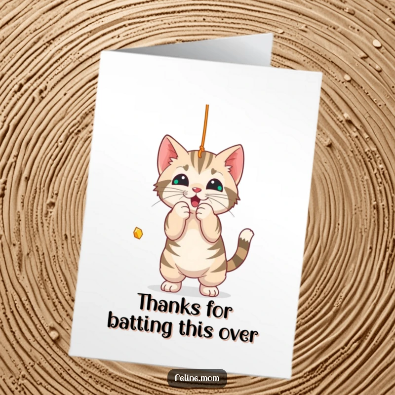 Funny Free Printable Thank You Card: A tabby cat joyfully bats at a dangling string, a playful thanks.